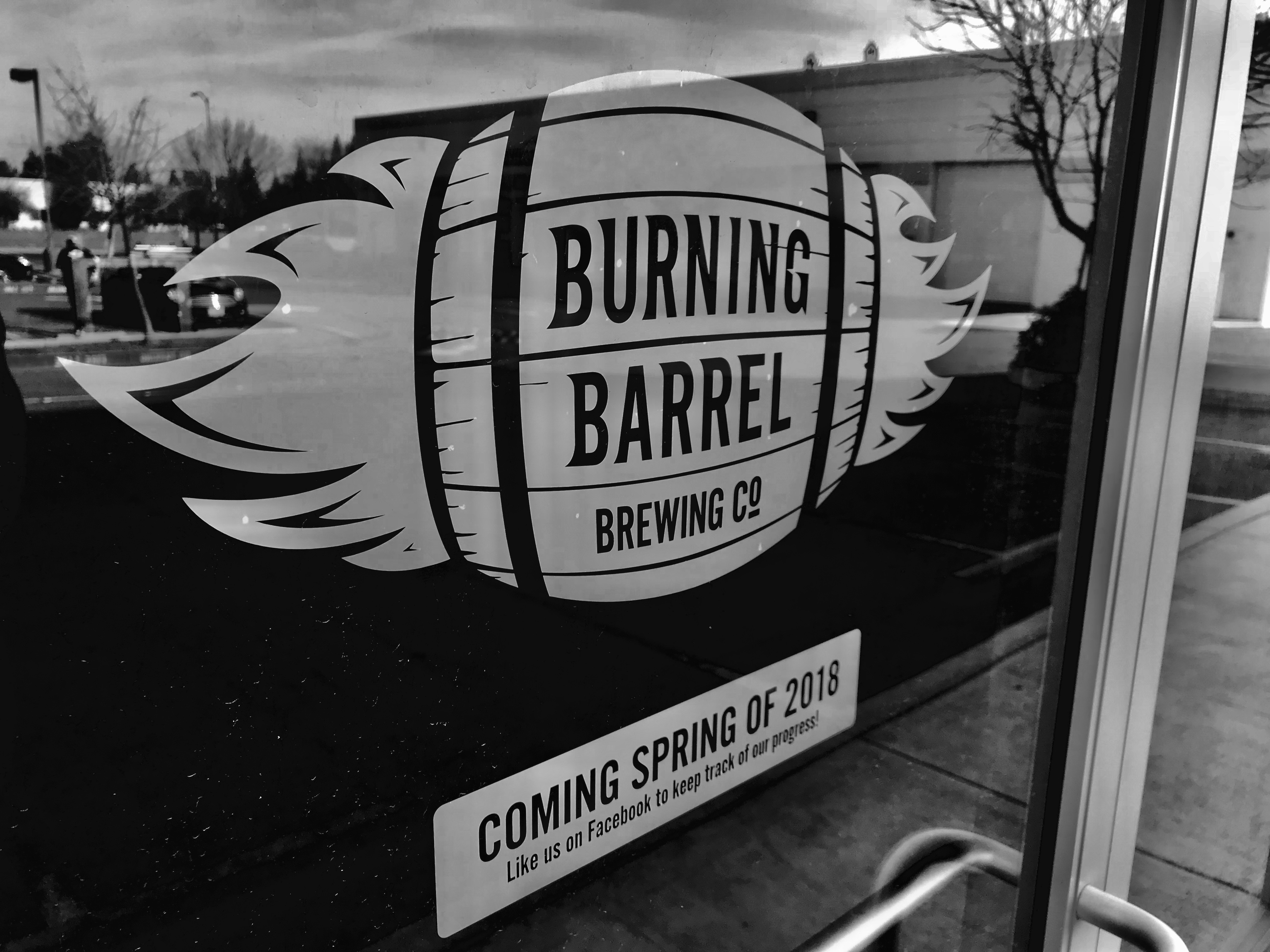 burning barrel logo on glass door